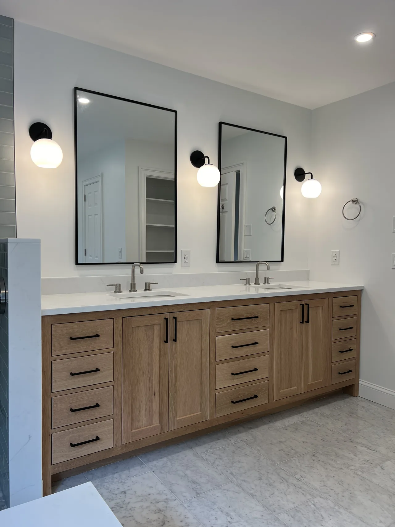 Wood vanity with careful alignment of cabinet doors and drawers