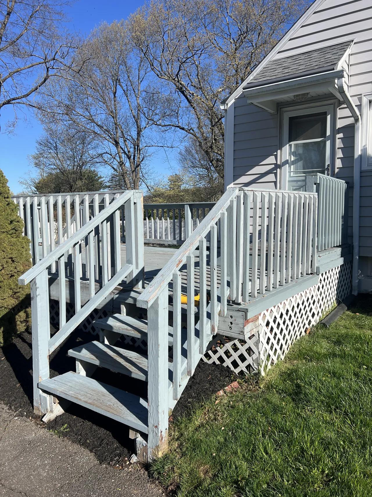 Before: weathered painted deck and stairs