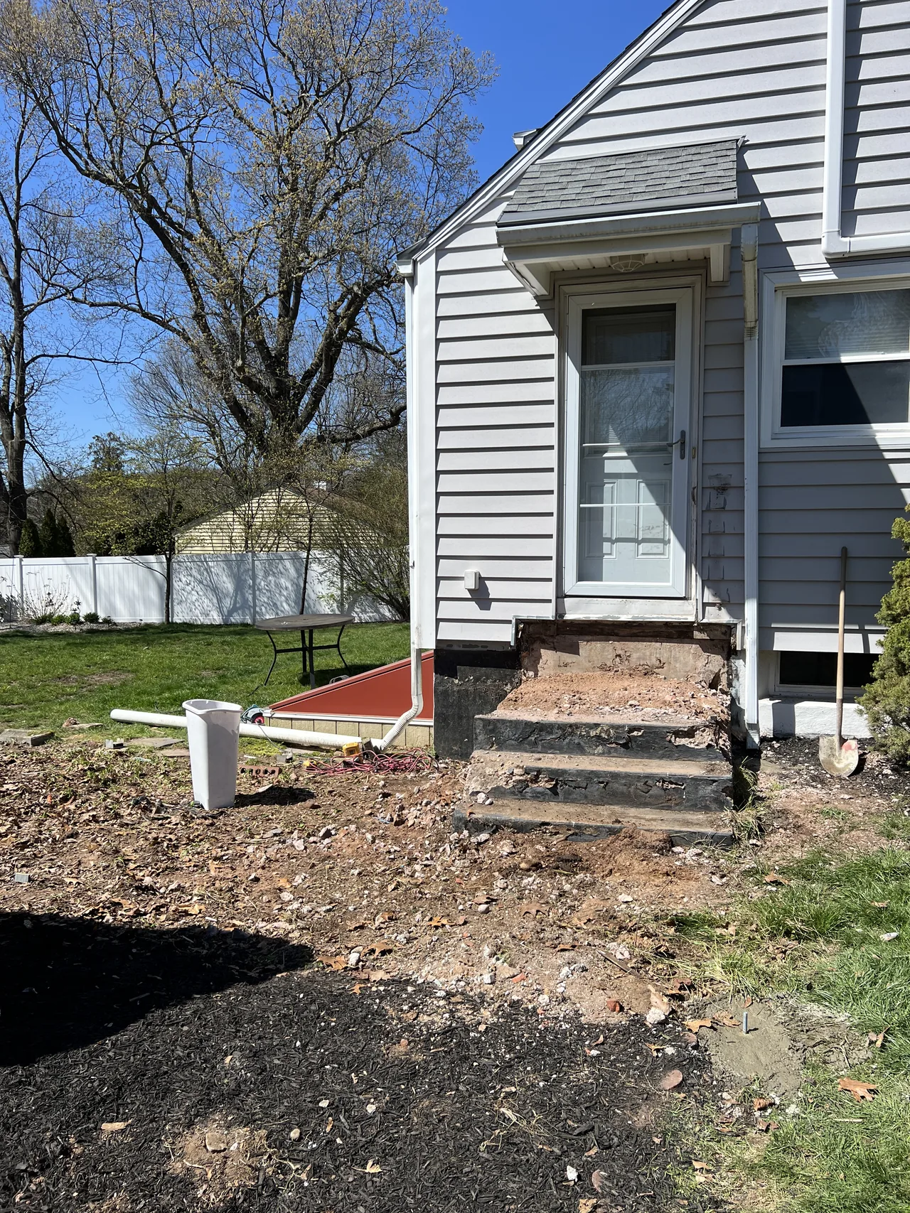 During: the deck removed before new framing